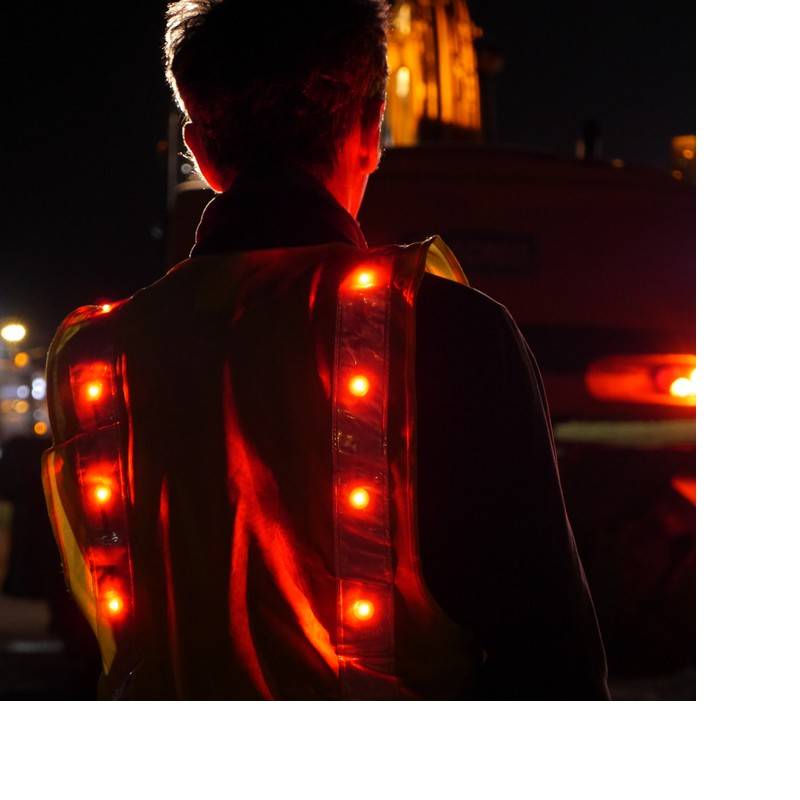 Prolutech LED safety vest used on night work sites.